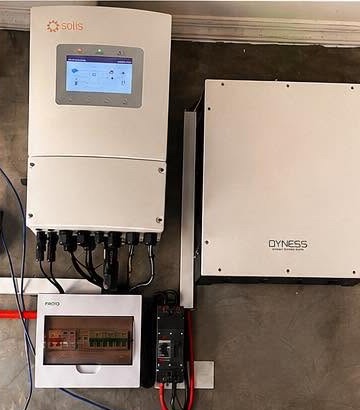 Solis hybrid inverter, Dyness battery and breaker box on a wall